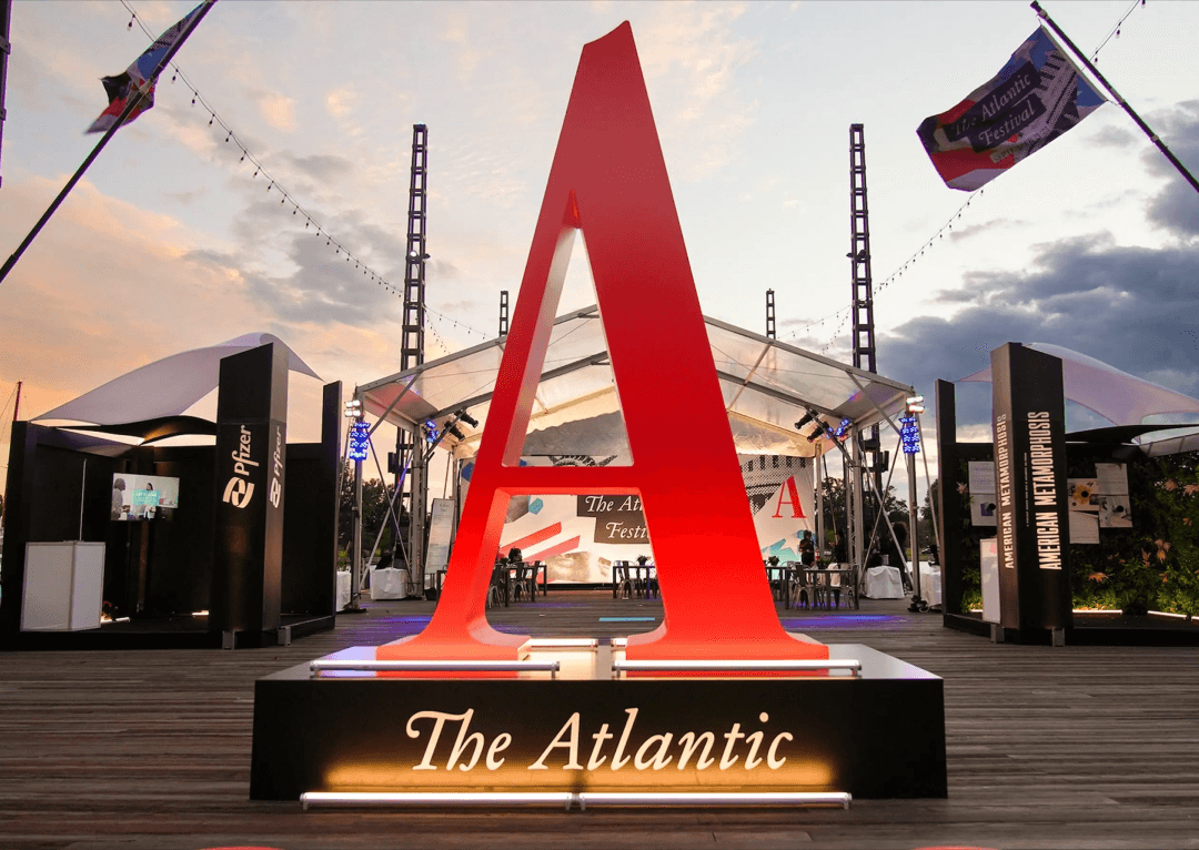 Photograph of the upper portion of the Atlantic magazine issue from December 2019. A handprint is depicted in red and blue paint. The Atlantic acronym logo in the top left, seen large.