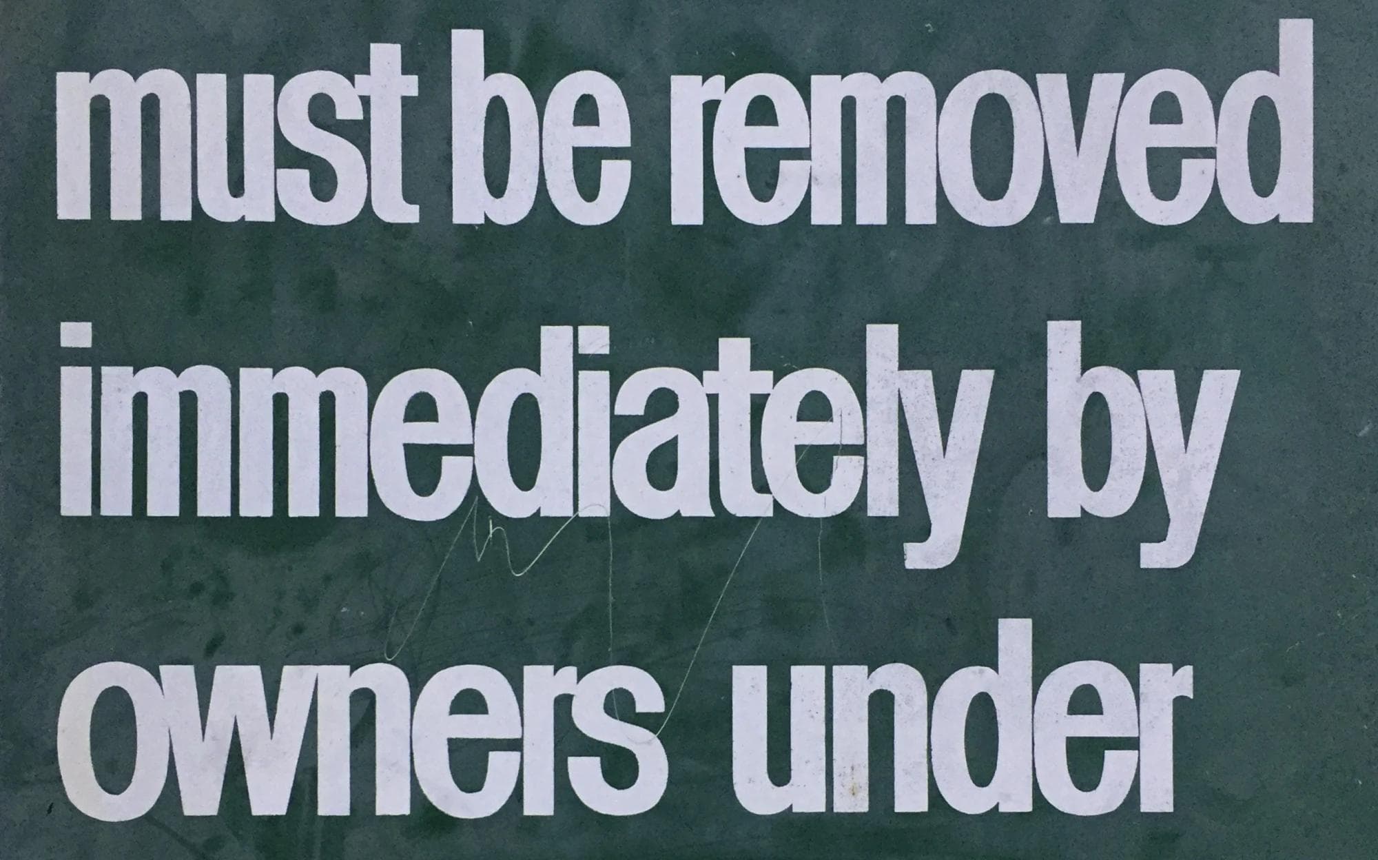 Detail of the original sign at the Silverlake reservoir.